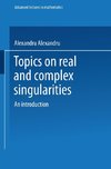 Topics on Real and Complex Singularities